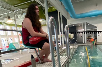 Lifeguard on duty watching the pool  