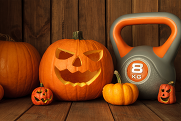 a jack-o- lantern and a 8 kg kettlebell 