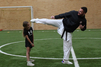 Instructor demonstrating Karate Kick