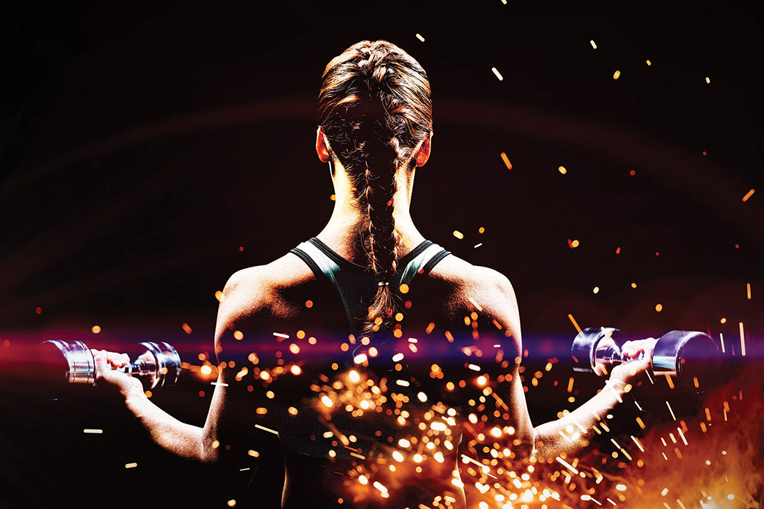 Lady lifting weights with a sparkle background