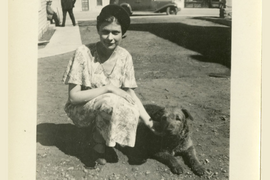 Lois Goodhue sitting next to her dog