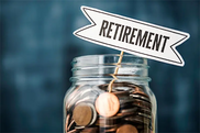 Jar of coins into which is placed a little sign reading 'Retirement'