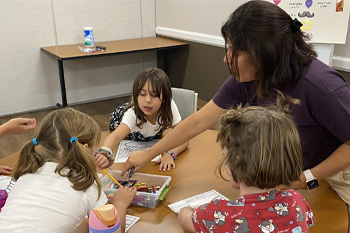 Kids doing activities in Spanish Explorers class 