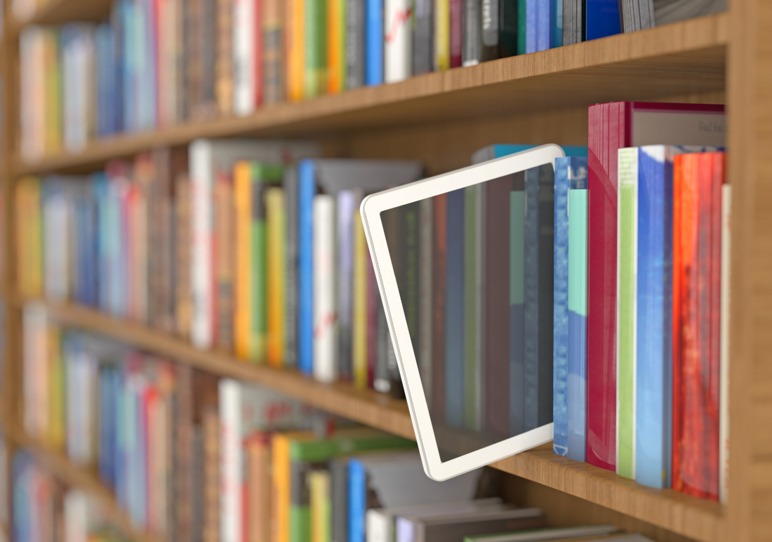 colorful bookshelf with e-reader tablet sticking out between books