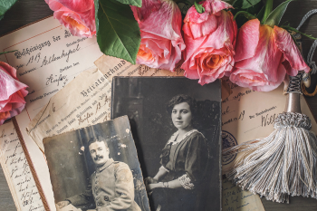 Ancestry Series Photos and Records on Table with Roses