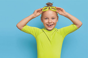 Little kid with swim gear on
