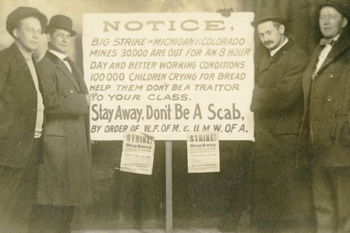 Historic Photo of Stikers Holding a Sign Supporting the Long Strike