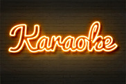 Brick wall with neon 'Karaoke' text