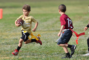 two kids playing flag football