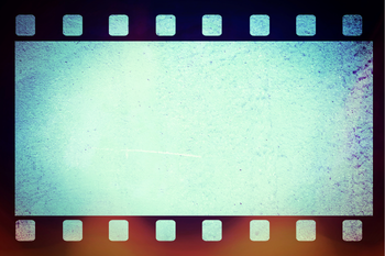 Vintage film strip frame with a blank blue center and worn edges