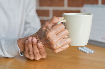 Photo of person holding a mug