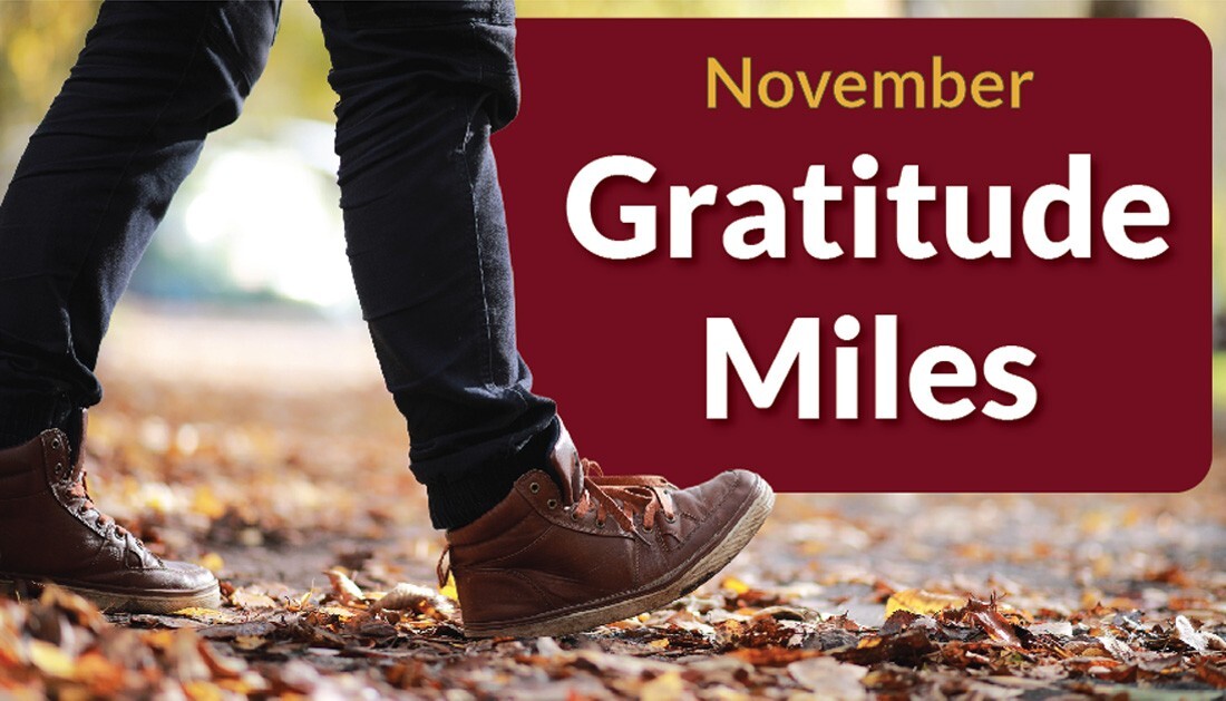 Feet walking over leaves with the text "November Gratitude Miles" 
