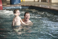 father and son swimming