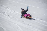 girl sledding