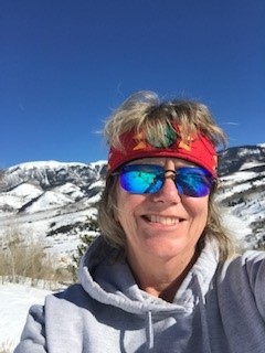 Stacey Wischnack snowshoeing in her backyard