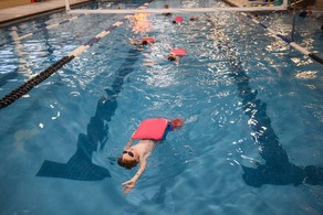 boy swimming in pool