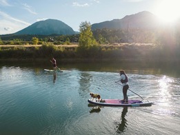 adults paddleboarding at North Pond Park