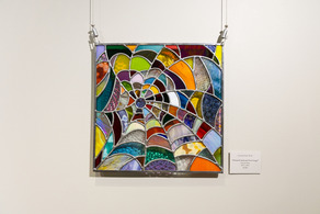 stained glass patchwork spiderweb by Colorado Glass Works