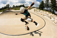 kid skateboarding at outdoor skate park