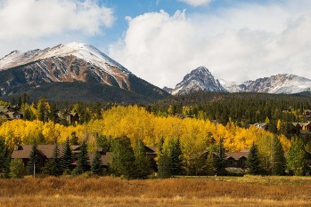 fall colors with snowy mountains in background