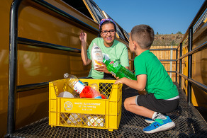women and boy recycling
