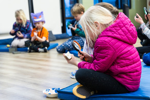 Little girl with magnifying glass
