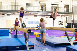 girls on balance beams