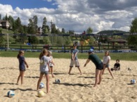 youth playing beach volleyball