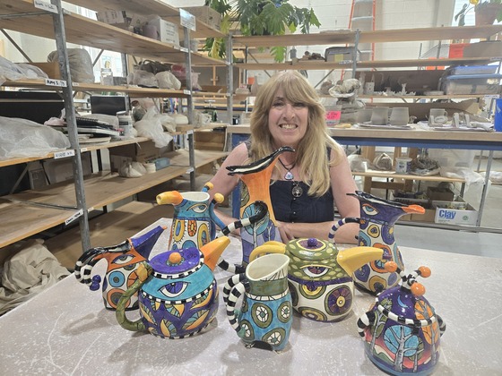 Artist Lori Weissmann with her ceramic work