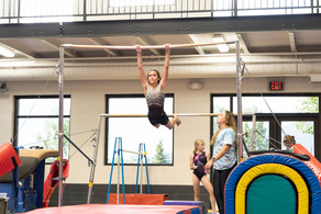 girl on gymnastics uneven bars