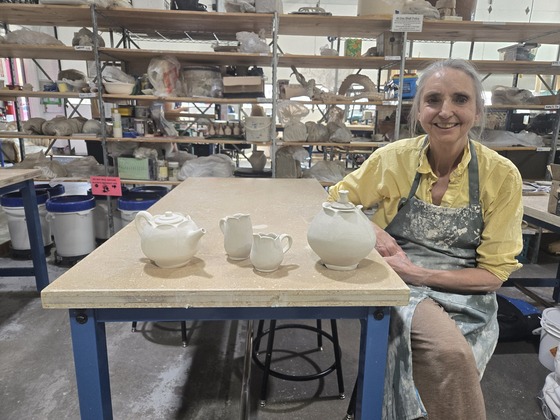 Artist Ruthann Sherrier with her ceramic pottery