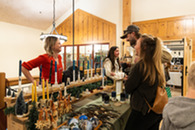 people shopping at a holiday art market