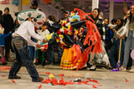 boy with pinata at dia de los muertos celebration
