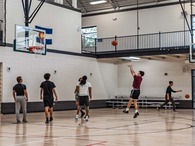 group of men playing basketball