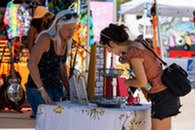 artist and shopper at art stroll