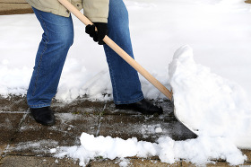 man snow shoveling