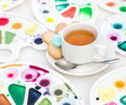 Tea cup with paint palettes 