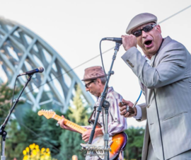 Delta Sonics band member singing on stage