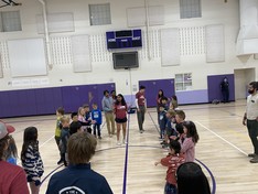 Children line up for a game during parents night out
