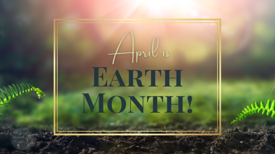 April is Earth Month promotional image. Words against a background with soil and green vegetation.