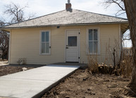 An older framed structure in the historic Grasso Park