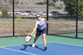 Pickleball player lounging for a shot