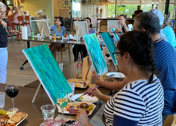 Adults paint, sip wine, and nibble on cheese and crackers at Toast n Tinker