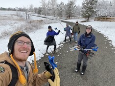 Earth Day clean up volunteers helping in the snow