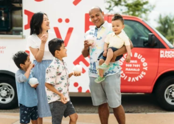 mother, father and 3 young kids enjoying Punch Buggy shaved ice