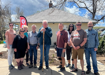 Members of the community gather in front of the Interim Historical Museum 