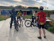 Bike commuters stop at a Superior station on Bike to Work Day in 2019