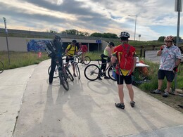 Bike commuters stop at a Superior station on Bike to Work Day in 2019