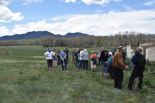 People standing outside listening to the commission chair 