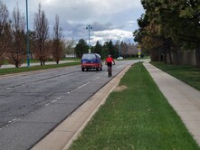 Rock Creek Parkway with a car and cyclist using it